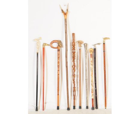 A collection of vintage 20th century novelty walking canes / swagger sticks. To include alien bust, female nude body, carved 