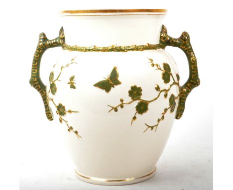 A large early 20th century circa 1910s twin handled chinoiserie ceramic vase. The vase on a rounded base, with bulbous body a