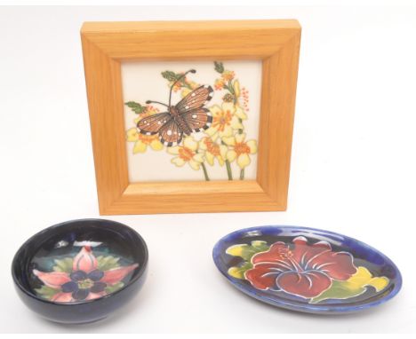 Moorcroft - A collection of three china porcelain Moorcroft items to include framed tile having white ground with daffodils a