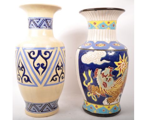 Two vintage 20th century ceramic pottery vases. Flared rim, tapering necks into bulbous body. Hand painted decoration, one fe