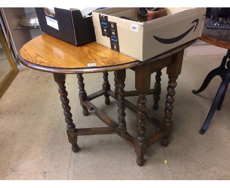 An oak barley twist gate leg table