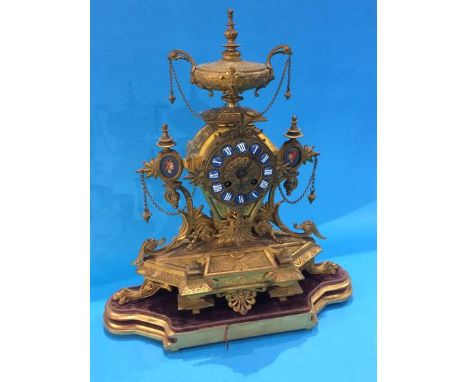 A gilt metal mantle clock, the movement stamped 'W.H. Tooke Paris'