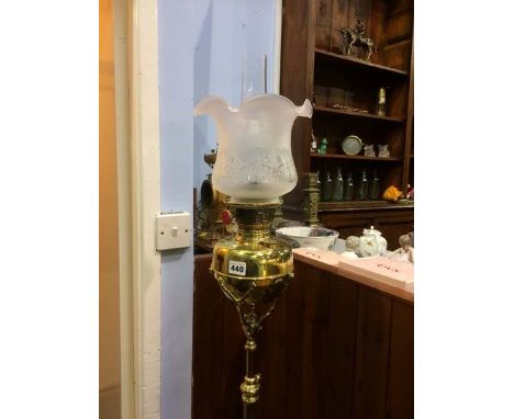 An oil lamp on telescopic brass stand
