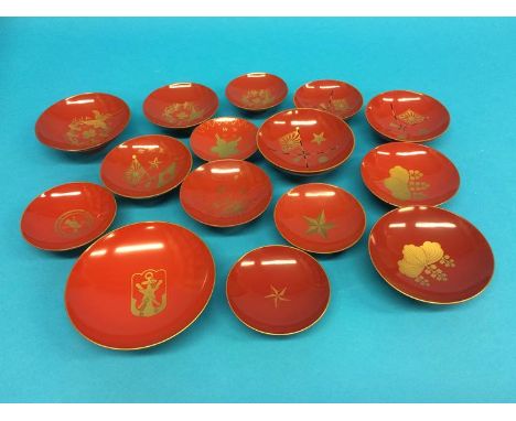 A set of three Japanese Imperial army red lacquered sake cups, Russian - Japanese war 1904, and a set of three military medic