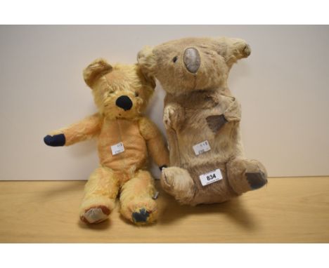 A Chad Valley yellow plush straw filled Teddy Bear having plastic eyes, stitched nose and mouth, replacement pads, original l