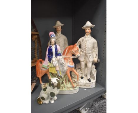 Two late Victorian Staffordshire Pottery Baden Powell figues, modelled standing aside a cannon, named with gilt lettering (on