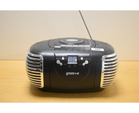 A vintage Groove portable stereo radio cassette recorder.