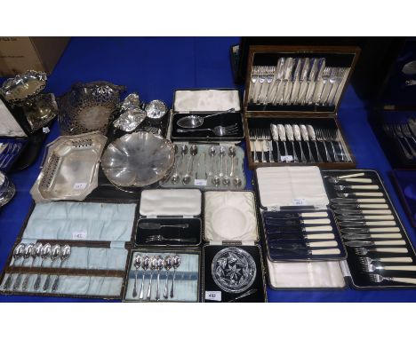 A collection of EPNS including cased fish knives and forks, teas spoons and sugar tongs, fruit knives, swing handled baskets,