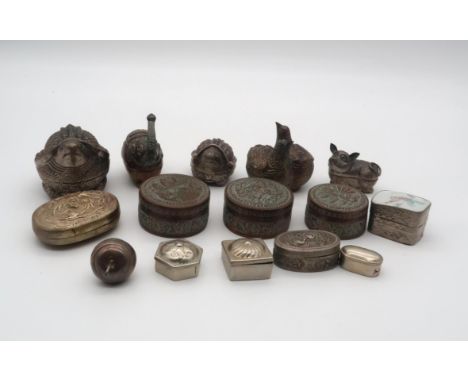 A collection of Cambodian white metal and EPNS betel boxes, some Zoomorphic, including pigs, turtles, elephants, quails, some