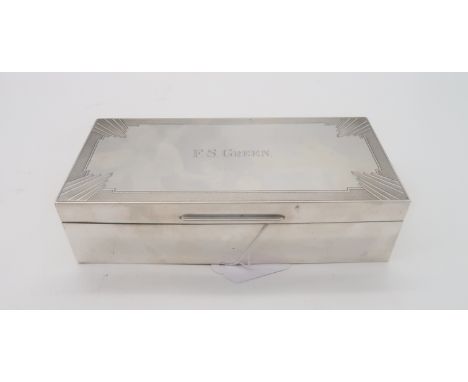A George V silver cigarette box, by William Hutton &amp; Sons, London 1932, the lid with Art Deco engine turned decoration, i