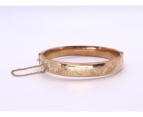 A 9ct Bangle with leaf engraving, hallmarked Birmingham 1994 inner diameter 6.2cm 12.6grms Condition Report:Available upon re
