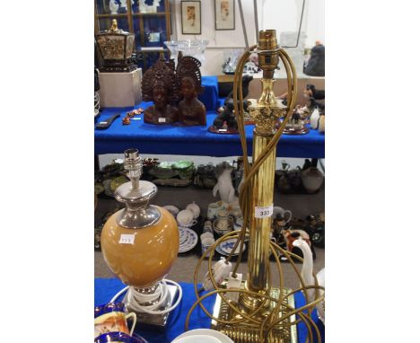 A brass column table lamps, together with another lamp Condition Report:Available upon request