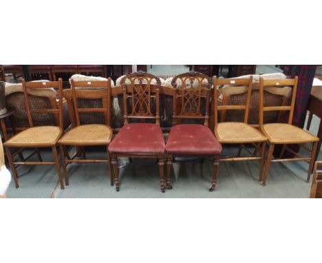 A lot comprising a pair of Victorian rosewood parlour chairs with pierced splats over button upholstered seats and four beech