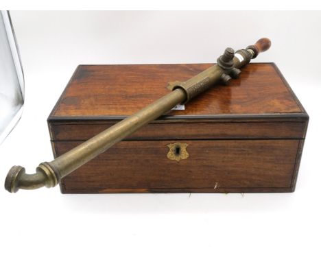 A mahogany writing slope, the lid inset with a vacant shield-form brass plaque, the interior with gilt tooled deep purple Mor