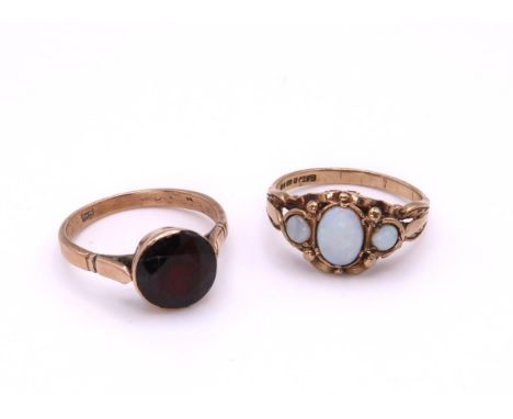 A 9ct gold opal ring, size N1/2, a 9ct gold garnet ring, size O, weight together 5.6gms Condition Report:Available upon reque