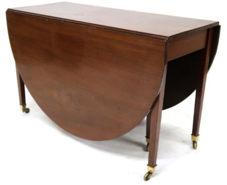 A VICTORIAN MAHOGANY DROPLEAF TABLE&nbsp; with oval drop leaf top on square tapering supports terminating in ceramic casters,