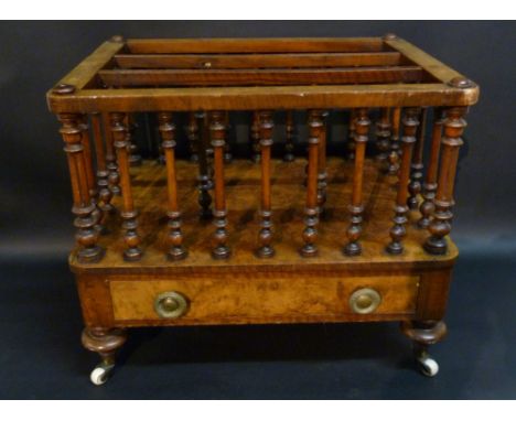 A Victorian Burr Walnut Three Division Canterbury with turned uprights above a frieze drawer with brass knob handles raised u