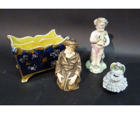 A Gilded Bisque Figure, together with a Staffordshire figure, a Dresden porcelain figure and a small jardiniere