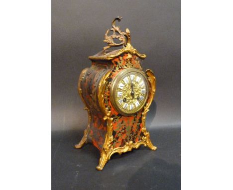 A 19th Century French Ball Mantle Clock, the brass dial with enamel Roman numerals and with twin train movement striking on a