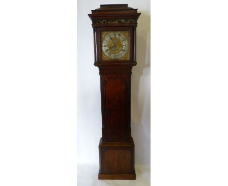 A George III Oak and Mahogany Cross Banded Clock, the hood with a pagoda cresting above a painted glass frieze and with turne