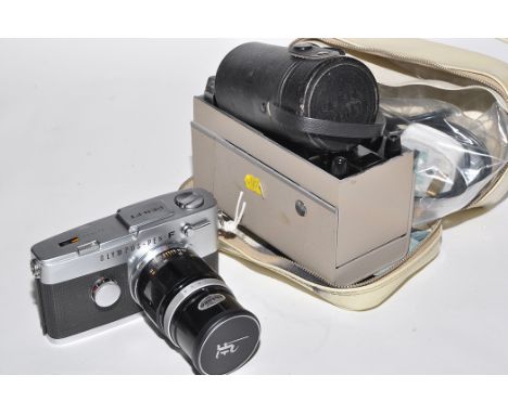 An Olympus-Pen F half-frame SLR camera (chrome), fitted a Zuiko 100mm f3.5 lens; together with an Olympus Pen-Projector for h