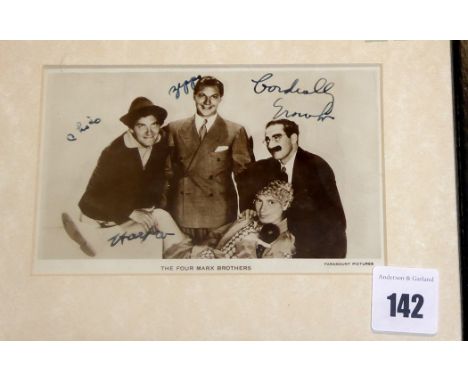 A black and white photograph inscribed 'The Four Marx Brothers', bearing signatures.