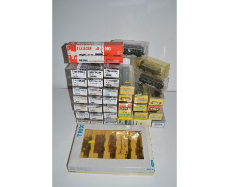 A quantity of Fleischmann H0-gauge model rolling stock; together with Trix H0-gauge rolling stock, all boxed.