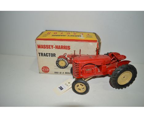 A Lesney Massey-Harris tractor, red with cream hubs, boxed.