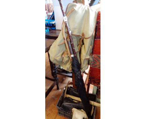 Old rucksack, ice axe, hiking sticks and two pairs of old ice skates