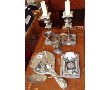 Assorted silver plate, inc. pair of candlesticks, cream jug, hand mirror, napkin ring etc.