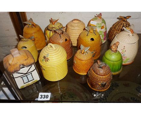 Collection of ten various lidded ceramic honey pots, honeycomb and beehives