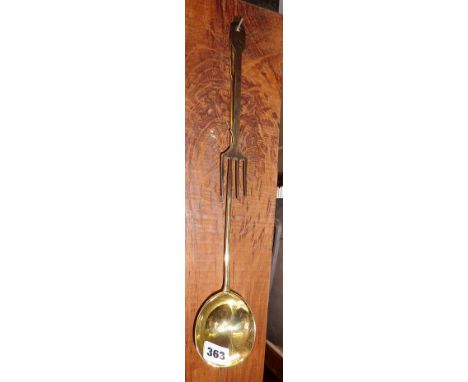 An 18th c. brass ladle with fig shaped bowl and an 18th c. polished steel fork