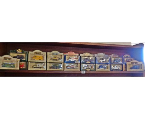 Long shelf of modern diecast Lledo vehicles boxed