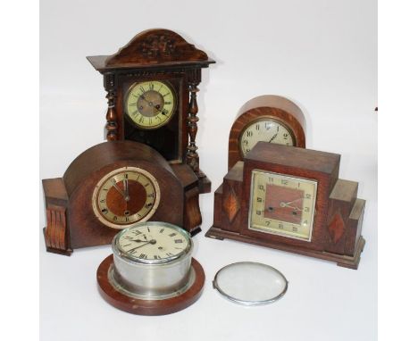 Five various clocks comprising a Smiths ship clock, an oak cased Art Deco three train mantel clock, a continental wall clock,