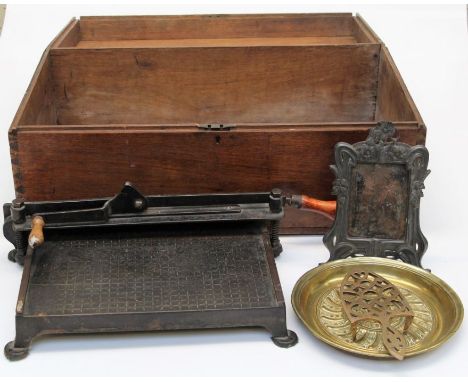 A 19th century teak chest, 68cm wide together with an Edwardian guillotine, a WMF style easel photograph frame, trivet and ot