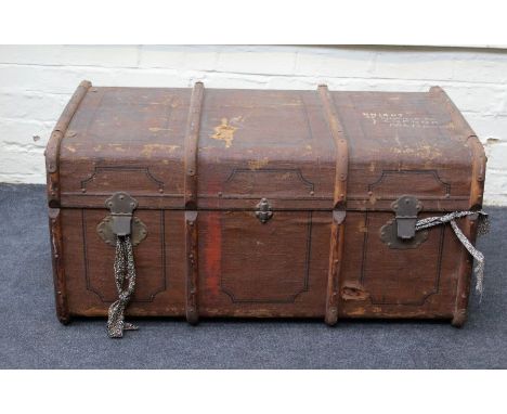 An Edwardian canvas, metal bound and wooded banded cabin trunk with twin leather handles and vacant interior. 96cm