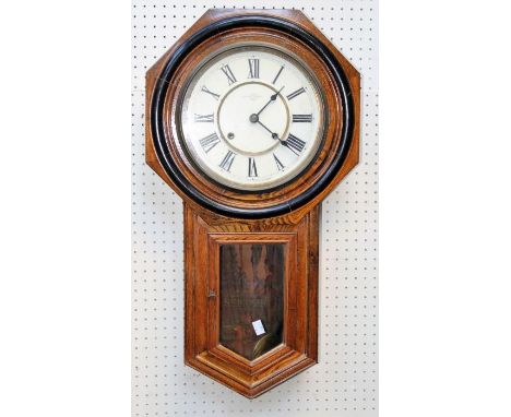 A circa 1900 Japanese oak cased drop dial wall clock, thirty hour gong striking movement faced by 10 inch Roman dial