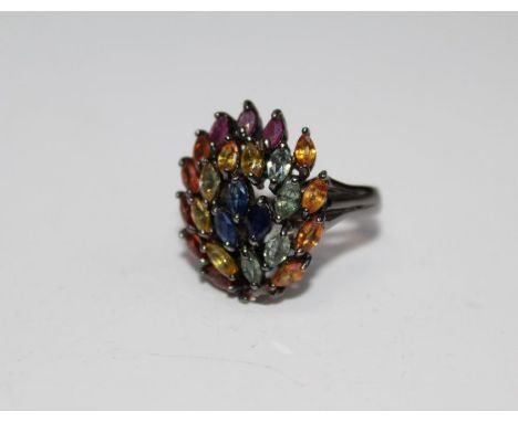 A multi coloured sapphire and ruby 925 stamped cocktail ring, size Q, gross weight approximately 7.8gm
