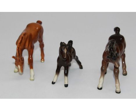 A Beswick figure 1085 foal in gloss brown, H9cm, a Beswick model 946 foal in gloss light brown, 2nd version H8cm, and a Beswi