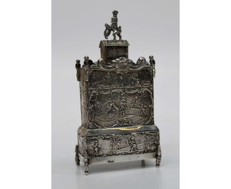 A late 19th century Dutch silver tea caddy and cover, fashioned as an 18th century chest on stand with heraldic lion finial, 