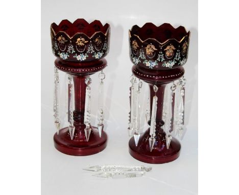 A pair of Edwardian ruby glass, florally enamel decorated table lustres, each with icicle pendant drops, 36cm