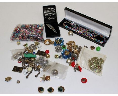 A quantity of quality period costume jewellery to include a gold plated dress button and brooch set with operculum, numerous 