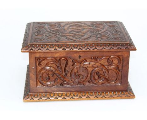 An oak wood cutlery box featuring poker work decoration, engraved Celtic style sea monsters and egg and dart moulding&nbsp;