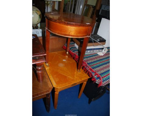 A light wood low level table, 27 1/2" x 21 1/2" x 2' high and a circular table, 22" x 25 1/2" high.