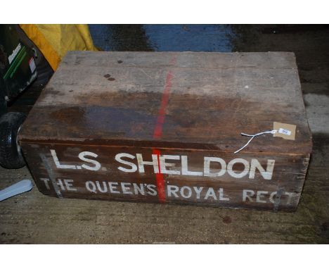 A pine travelling trunk, 41" x 2ft x 14" high, marked L.S. Sheldon, The Queens Royal Regt to front.