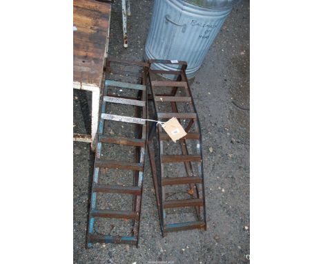 A pair of light duty car ramps.