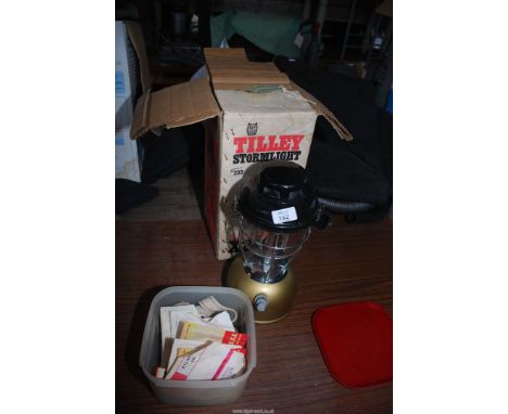 A boxed Tilley lamp and a box of wicks and mantles.