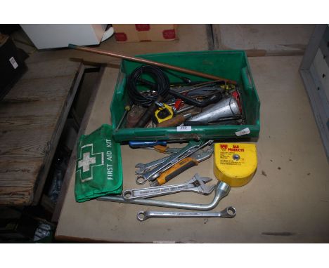 A trailer tow eye lock, miscellaneous tools, First Aid kit, etc.