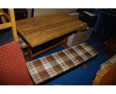A solid kitchen table and bench set, table having wood effect, benches padded, 42" x 2' x 29" high.