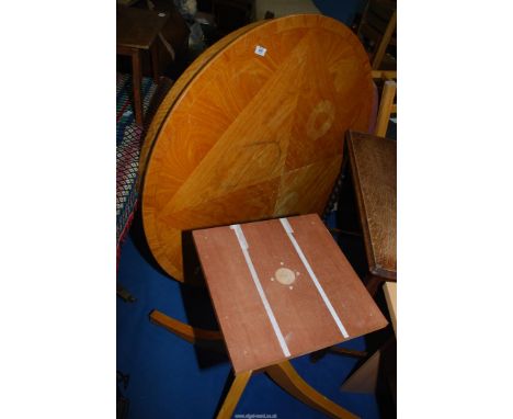 A light wood inlaid circular table with pedestal base, 47" wide x 29" high.